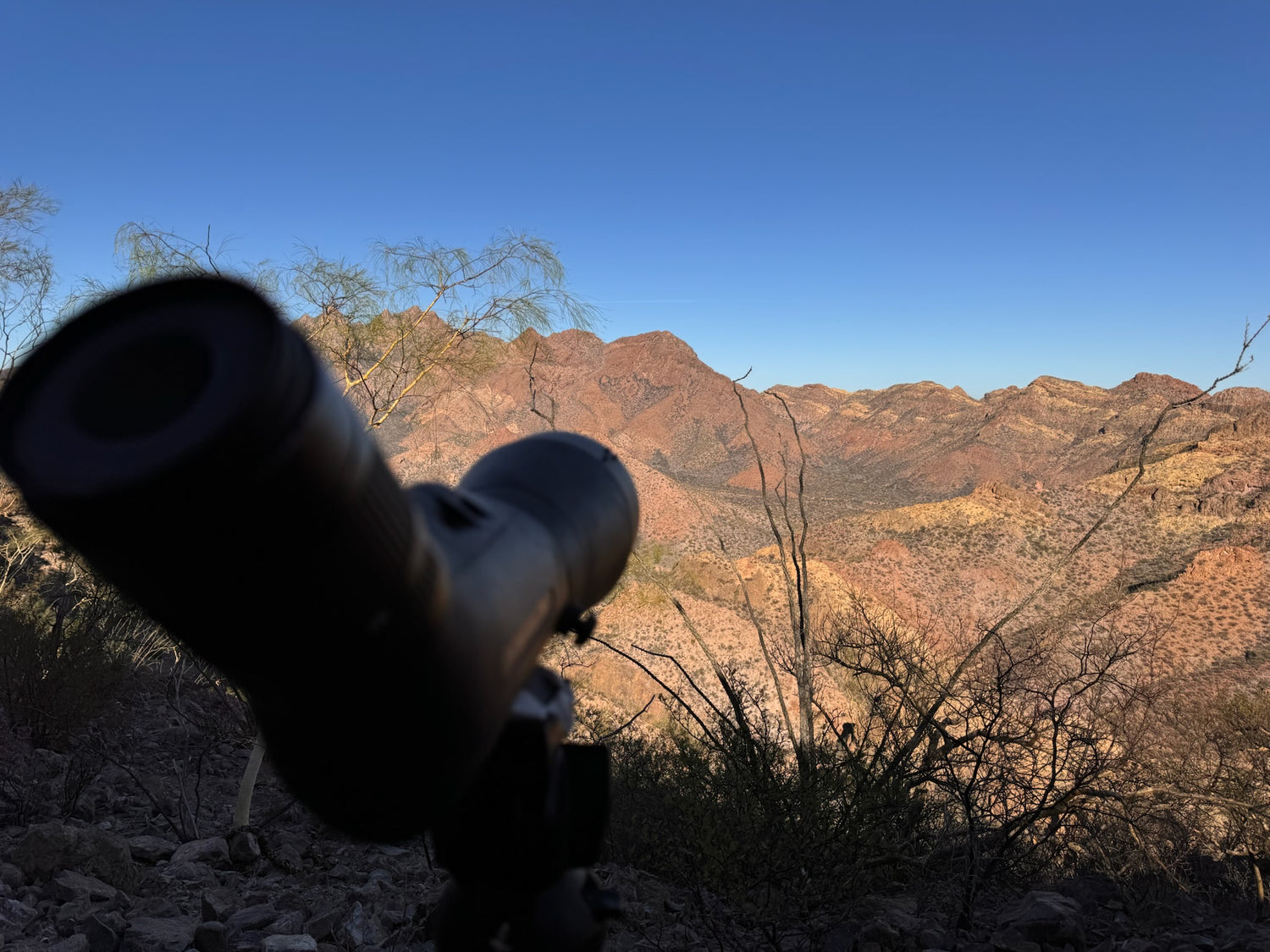 Scenery with mountains and binoculars in the foreground